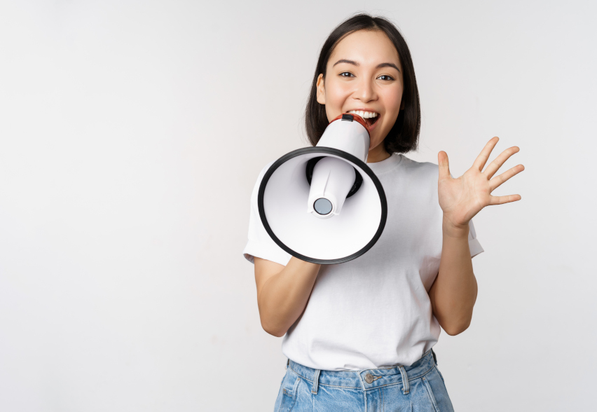Woman with megaphone explaining what feedback culture is
