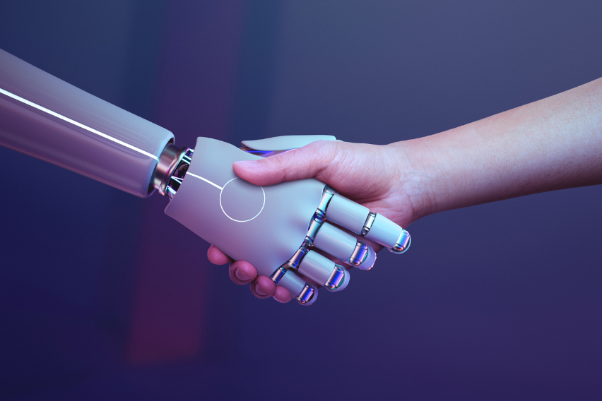 Hands of Artificial Intelligence and a human shaking